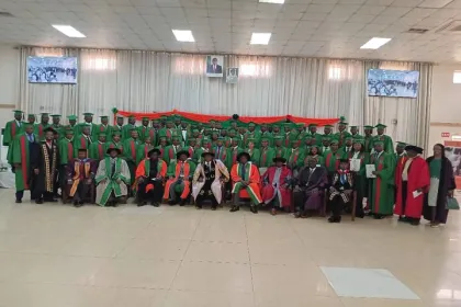 DVC poses for a photo with graduates